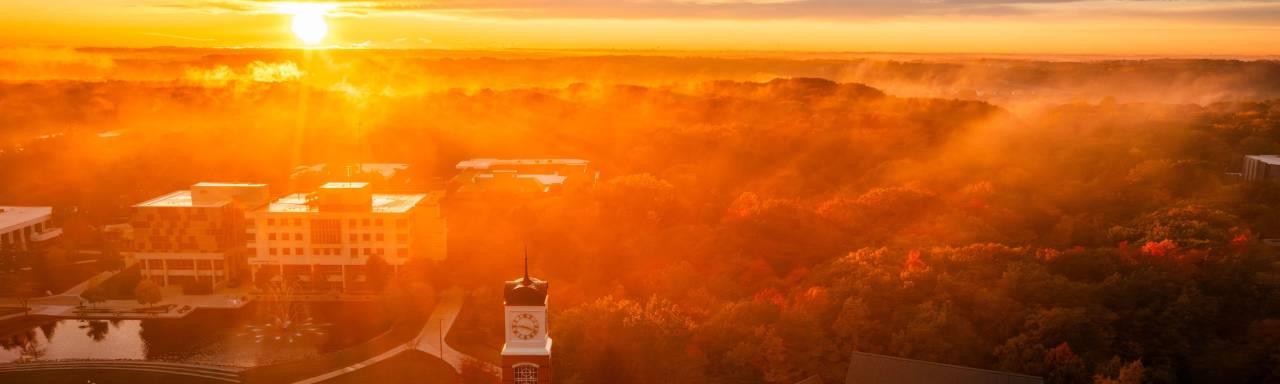 Image of sunrise over campus.